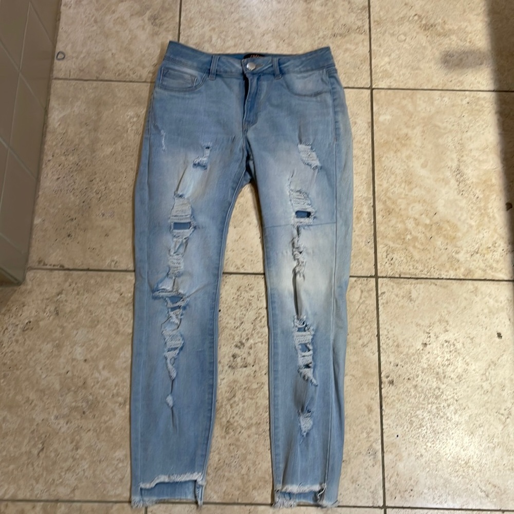 Woman’s stretch skinny jeans, ripped.